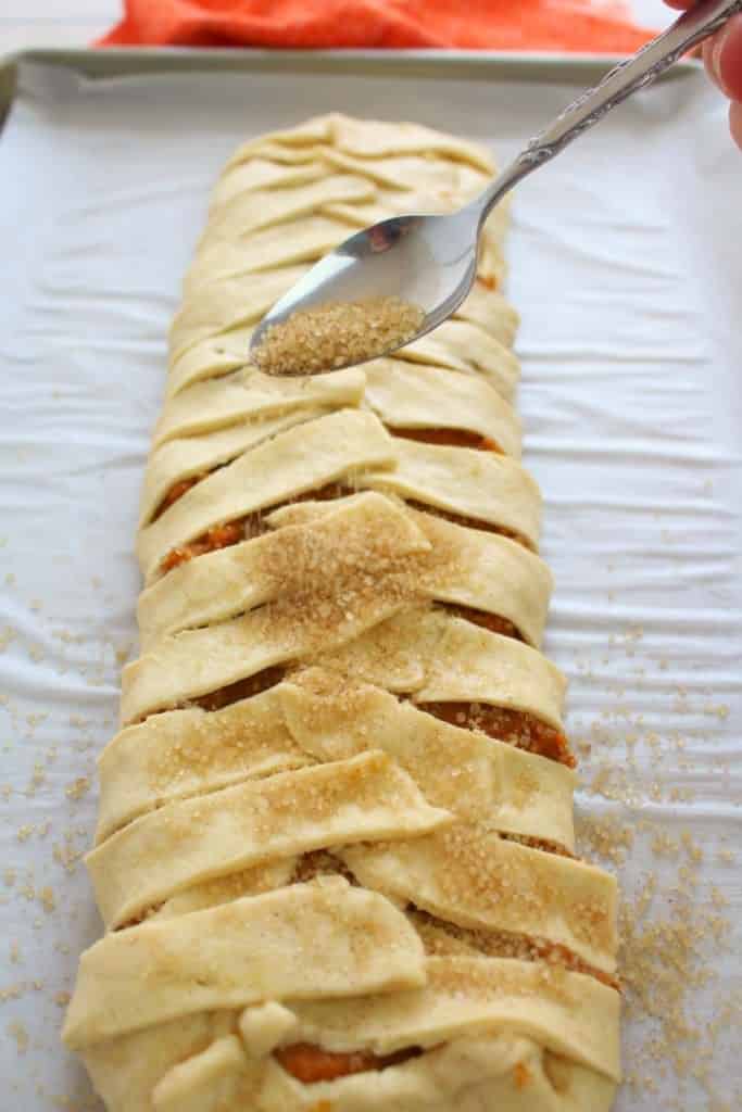 You'll never believe how easy it is to make this Pumpkin Cream Cheese breakfast braid recipe! Made with refrigerated crescent roll dough, and a few other ingredients, this gorgeous pumpkin pastry will look like you bought it at a fancy bakery!