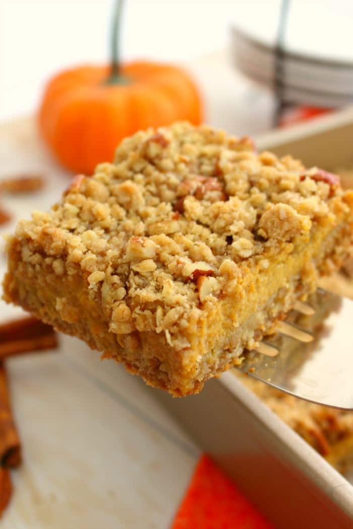 Even easier than pie, these Pumpkin Pie Bars with Pecan Crumble are the perfect fall dessert! Made with a simple oatmeal brown sugar crust, and topped with an amazing pecan crumble, this pumpkin dessert will be even more popular than the classic pie!