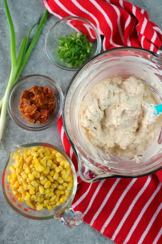 Loaded with crisp, savory bacon, sweet corn and lots of cheese, this hot & creamy Bacon Corn Dip recipe is sure to please! Serve fresh out of the oven oven with your favorite tortilla chips for a fantastic game-day snack or party appetizer.