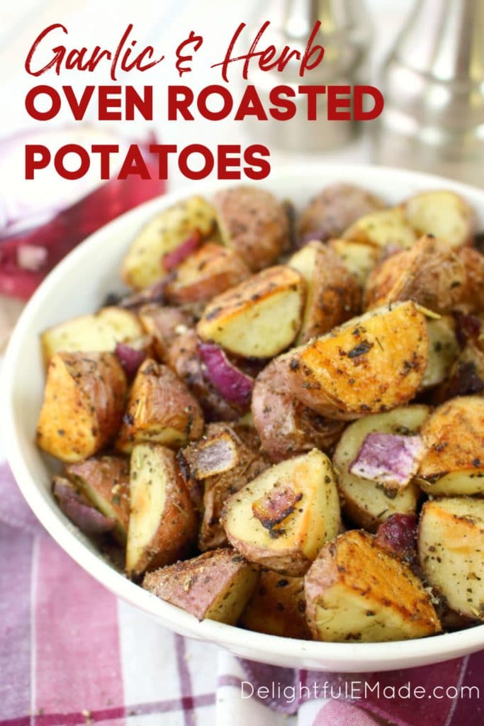 Bowl of oven roasted red potatoes with red onions, salt and pepper.