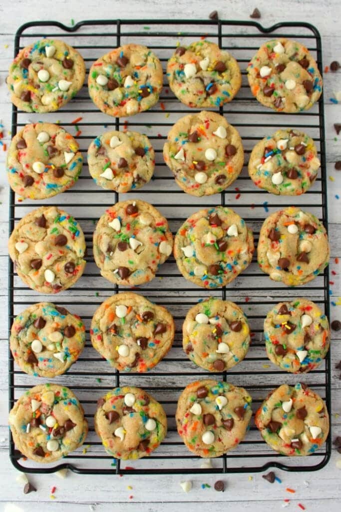 The ultimate chocolate chip cookie recipe! These Funfetti Chocolate Chip Cookies are loaded with sprinkles, white and semi-sweet chocolate chips, and packed with some serious flavor. Perfectly chewy, these cookies will be your new go to cookie recipe!
