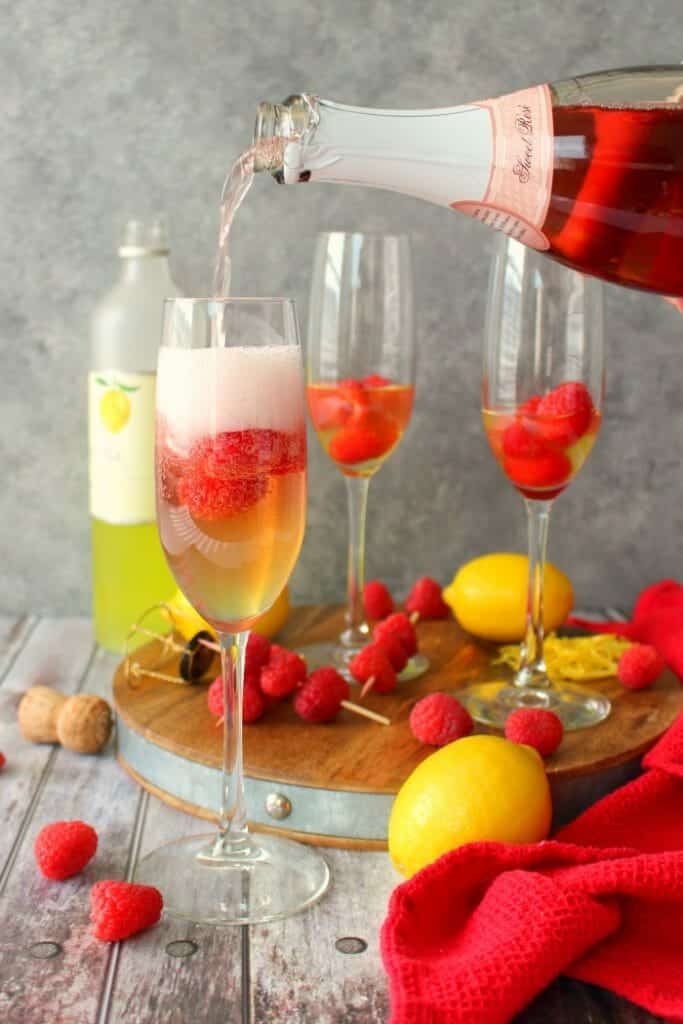 Mimosas brought to a whole new, glorious level! These Lemon Raspberry Mimosas are made with fresh raspberries, lemoncello liqueur, and topped off with a Champagne Rosé. Your brunch just got even more fabulous!