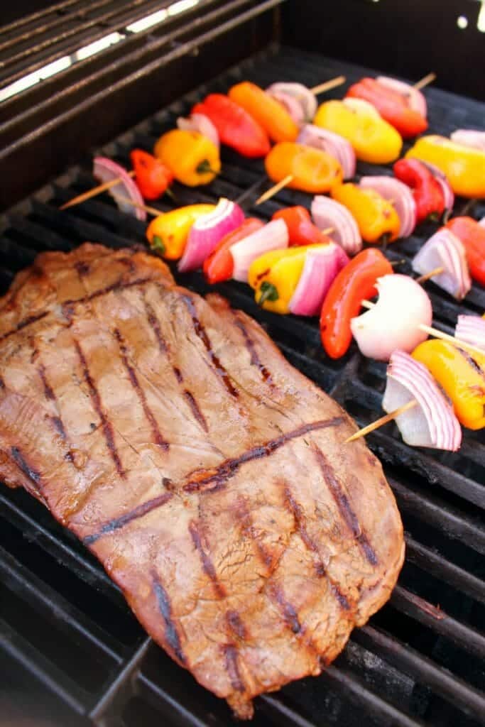 Get restaurant quality fajitas right at home! These savory Grilled Steak Fajitas will be your new favorite Tex-Mex meal. Made with tender, juicy flank steak and grilled with peppers and onions, this fajita recipe is simple to make and completely delicious!