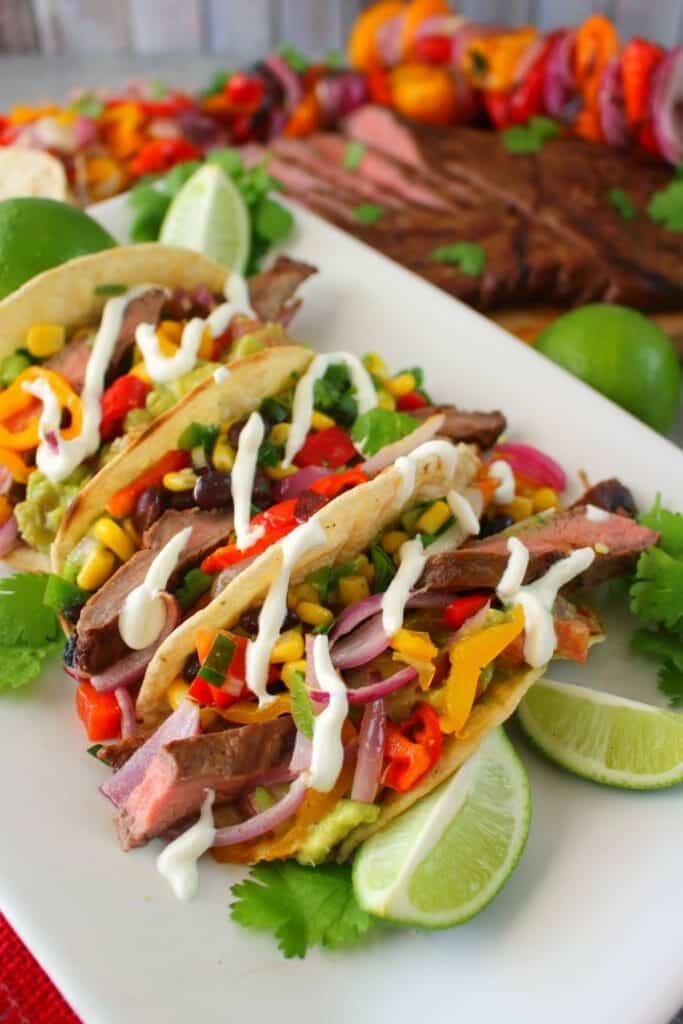 Get restaurant quality fajitas right at home! These savory Grilled Steak Fajitas will be your new favorite Tex-Mex meal. Made with tender, juicy flank steak and grilled with peppers and onions, this fajita recipe is simple to make and completely delicious!
