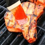 Meet your new favorite BBQ Pork Chops recipe! These super-simple grilled pork chops are made with a homemade honey bourbon barbecue sauce, and grilled to perfection. This will be your new favorite way to grill pork chops!
