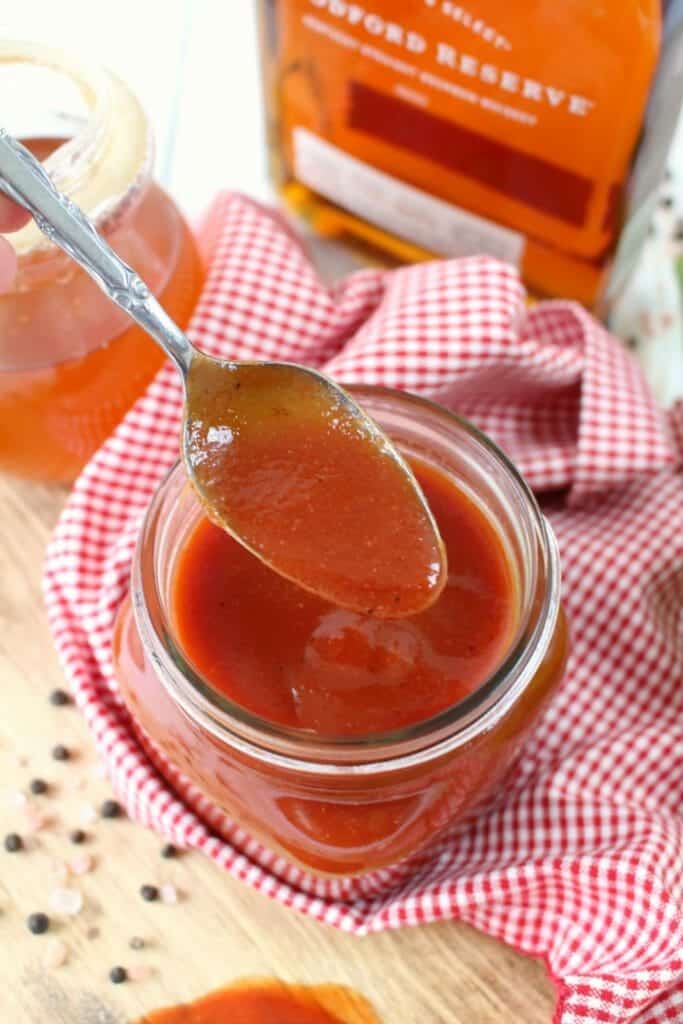 Forget the bottled stuff, you'll want to grill everything in this delicious Honey Bourbon BBQ Sauce! Sweet, savory and with a bit of spicy kick, this homemade barbecue sauce recipe is super simple to make and fantastic on pork chops, chicken, ribs and even burgers!