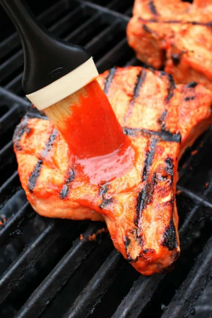 Forget the bottled stuff, you'll want to grill everything in this delicious Honey Bourbon BBQ Sauce! Sweet, savory and with a bit of spicy kick, this homemade barbecue sauce recipe is super simple to make and fantastic on pork chops, chicken, ribs and even burgers!