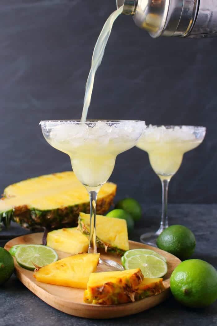 An amazing way to enjoy a fresh, delicious margarita! This easy Pineapple Margarita recipe is just 5 ingredients and comes together in moments. Fabulous for your next happy hour or celebrating Cinco de Mayo!