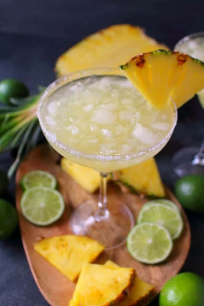 An amazing way to enjoy a fresh, delicious margarita! This easy Pineapple Margarita recipe is just 5 ingredients and comes together in moments. Fabulous for your next happy hour or celebrating Cinco de Mayo!