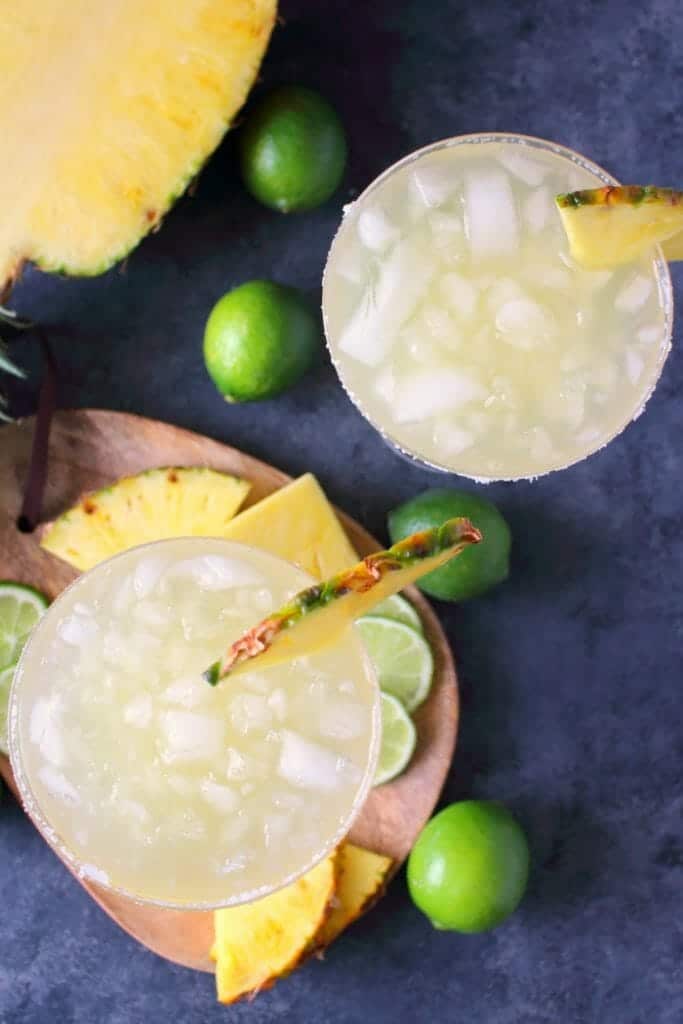 An amazing way to enjoy a fresh, delicious margarita! This easy Pineapple Margarita recipe is just 5 ingredients and comes together in moments. Fabulous for your next happy hour or celebrating Cinco de Mayo!