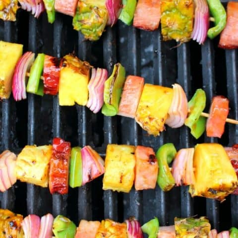 Get your cookout game on point with these incredible Hawaiian Ham & Pineapple Kebabs! Made with savory, delicious ham, fresh pineapple and veggies, these simple ham skewers will be your new favorite summer grilling recipe!