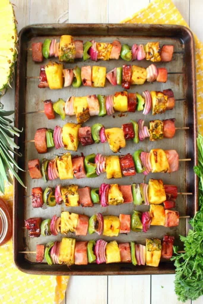 Get your cookout game on point with these incredible Hawaiian Ham & Pineapple Kebabs! Made with savory, delicious ham, fresh pineapple and veggies, these simple ham skewers will be your new favorite summer grilling recipe!