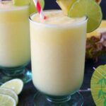 Meet your new favorite summer drink! This incredible Pineapple Daiquiri recipe is made with fresh pineapple, limes and coconut cream. Perfect for sipping poolside or blending for all of your friends at your next summer cookout!