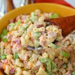 The ultimate Macaroni Salad recipe! Loaded with fresh carrots, celery, diced bell pepper, red onion, and savory ham, this Classic Macaroni Salad is perfect side dish for your next cookout or pot-luck. 