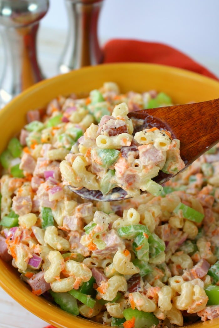 The ultimate Macaroni Salad recipe! Loaded with fresh carrots, celery, diced bell pepper, red onion, and savory ham, this Classic Macaroni Salad is perfect side dish for your next cookout or pot-luck. 