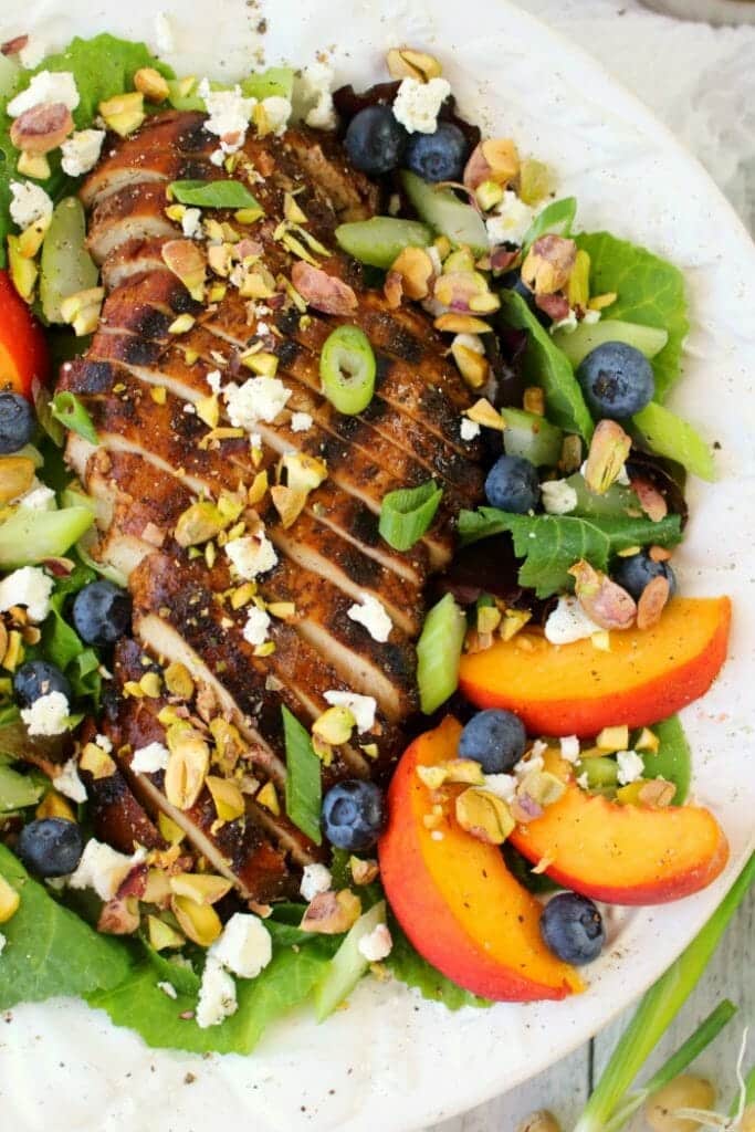 Craving a fresh, crisp entree salad? This savory, and slightly sweet Balsamic Grilled Chicken Salad will totally hit the spot! Made with fresh greens, fruit, pistachios and balsamic grilled chicken, this salad is healthy, filling and completely delicious!
