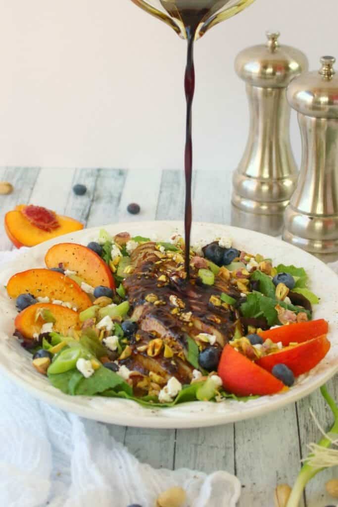 Craving a fresh, crisp entree salad? This savory, and slightly sweet Balsamic Grilled Chicken Salad will totally hit the spot! Made with fresh greens, fruit, pistachios and balsamic grilled chicken, this salad is healthy, filling and completely delicious!