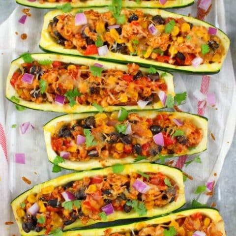 Looking for a healthy, low-carb dinner idea that actually tastes good? These Stuffed Taco Zucchini Boats are made with lean ground turkey filling along with peppers, onions, beans and corn. Loaded with flavor, these stuffed zucchini are the perfect healthy dinner!