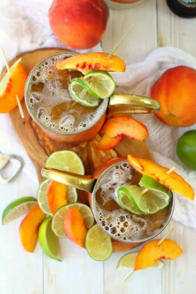 A delicious twist on the classic Moscow Mule recipe! Made with just a few simple ingredients, this Ginger Peach Moscow Mule combines the cold, crisp flavors of ginger beer with fresh peaches. Cheers!