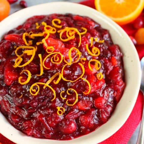 Incredibly simple to make, this flavorful and delicious Homemade Cranberry Sauce recipe will be your new favorite Thanksgiving side dish! Simply simmered with dried apricots, orange juice and orange zest, this cranberry sauce goes perfectly with any holiday meal!