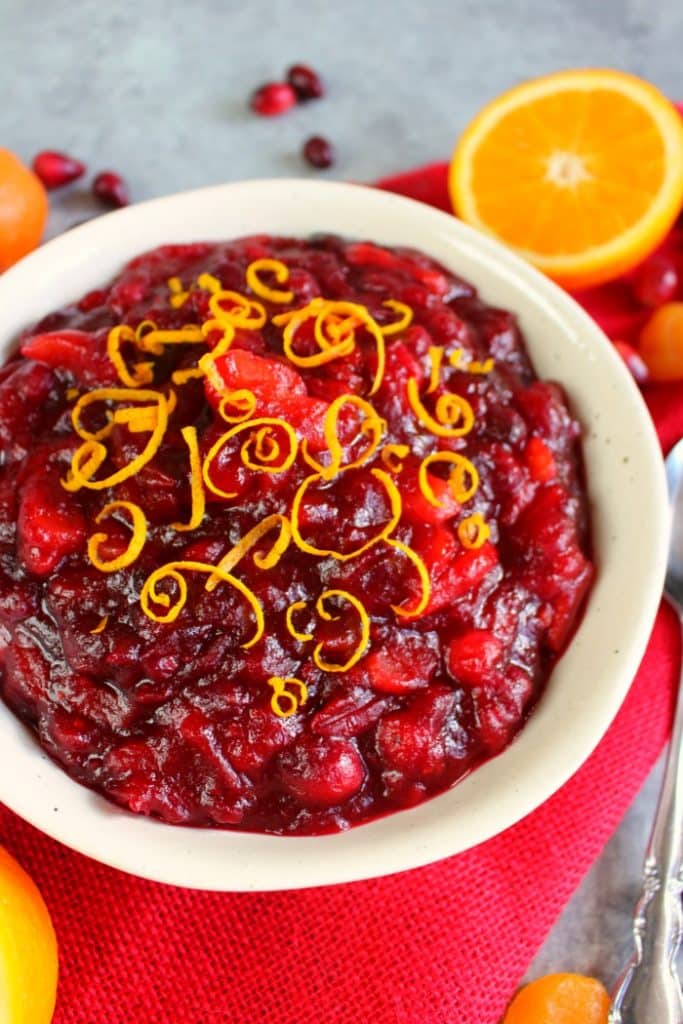 Incredibly simple to make, this flavorful and delicious Homemade Cranberry Sauce recipe will be your new favorite Thanksgiving side dish! Simply simmered with dried apricots, orange juice and orange zest, this cranberry sauce goes perfectly with any holiday meal!