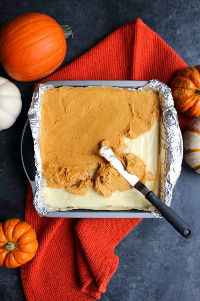 Otherwise known as pumpkin lush or pumpkin lasagna, this scrumptious Layered Pumpkin Dessert is the ultimate fall treat! Made with a pecan crust, and layers of cream cheese, pumpkin and whipped topping, this will be your new favorite Thanksgiving dessert!
