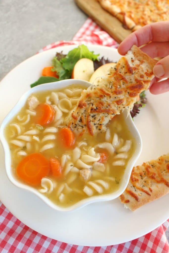 These Easy Cheesy Breadsticks are gonna be your soup's BFF! This super simple recipe for cheesy garlic breadsticks are the perfect side for just about any meal, especially soup and salad!