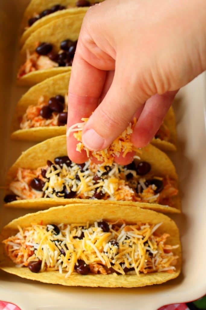 This recipe for Baked Chicken Tacos will be your new favorite way to enjoy taco Tuesday! Made with savory shredded chicken, and topped with all of your favorites, these tacos will become an instant favorite.