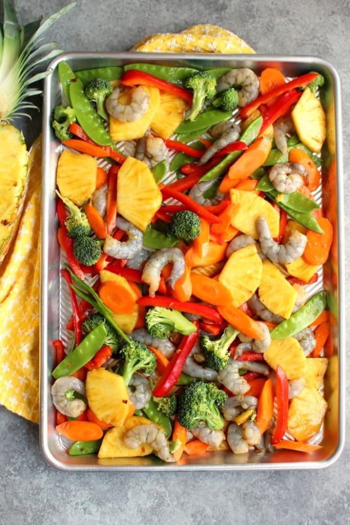 Love take-out food, but not all the calories and fat? This delicious, healthy Sheet Pan Sweet and Sour Shrimp recipe is fantastic for satisfying that craving! Crisp, delicious vegetables paired with tender shrimp in a light ginger sauce also makes for a healthy meal-prep idea!