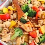 This Healthy Cashew Chicken recipe will be your new favorite weeknight dinner idea. Simply made, this sheet pan dinner idea is loaded with veggies and an amazing sauce.