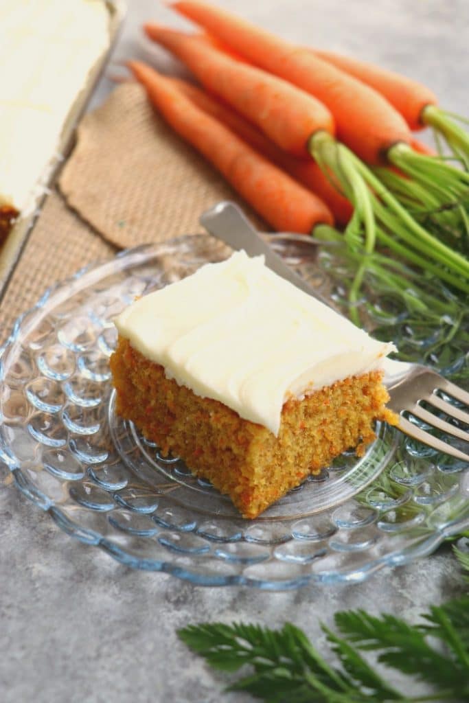 Don't have time for a layer cake? This Carrot Sheet Cake is where it's at! The perfect dessert for your Easter dinner or spring celebration, this Carrot Cake Sheet Cake with Cream Cheese frosting is amazing!