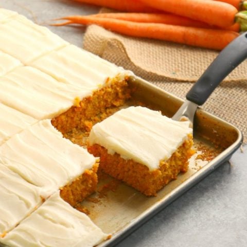 Don't have time for a layer cake? This Carrot Sheet Cake is where it's at! The perfect dessert for your Easter dinner or spring celebration, this Carrot Cake Sheet Cake with Cream Cheese frosting is amazing!