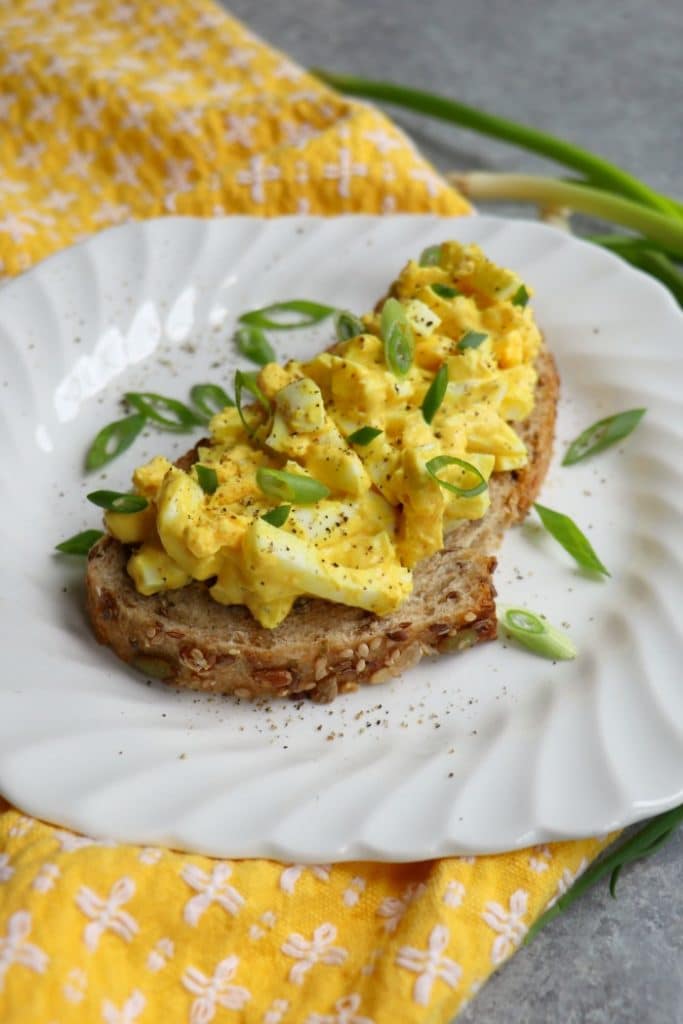 Need a way to skinny-up your Egg Salad sandwich? My Healthy Egg Salad with Greek Yogurt is amazing! Loaded with protein, and packed with flavor this Egg Salad recipe is just 5 simple ingredients!