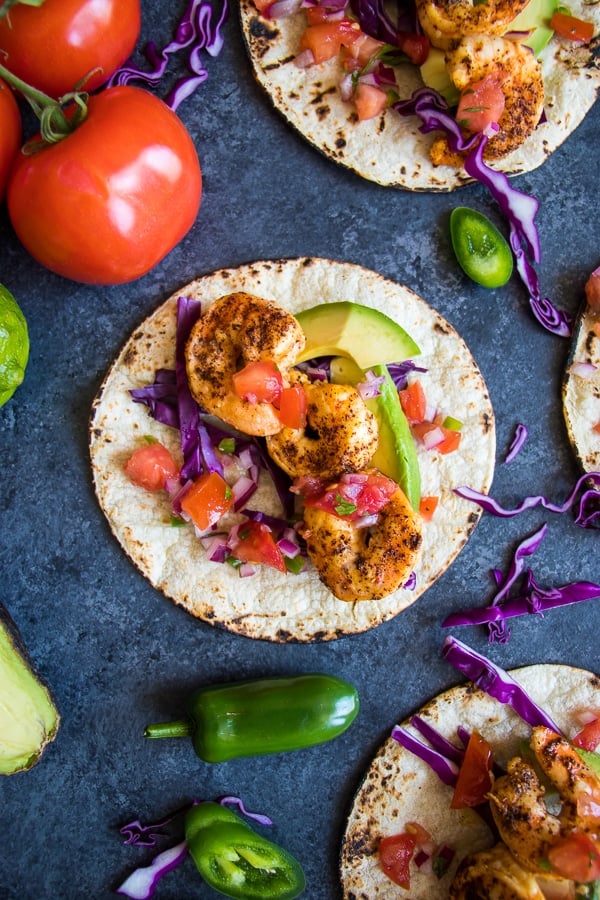 Taco Tuesday just got a major upgrade! My Healthy Shrimp Tacos with Chili Lime Shrimp are going to be your new favorite taco recipe! Made with delicious chili lime seasoned shrimp and all the healthy toppings, these tacos are amazing!