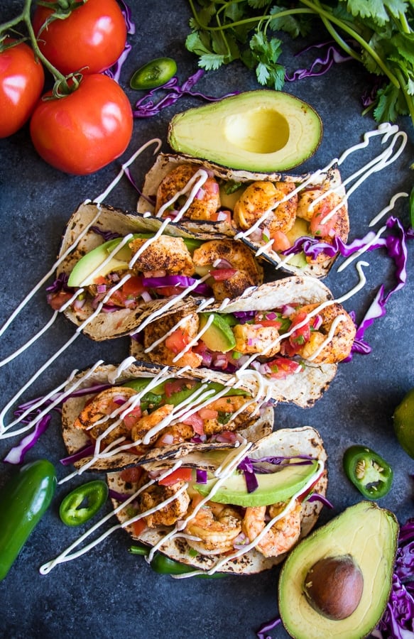 Taco Tuesday just got a major upgrade! My Healthy Shrimp Tacos with Chili Lime Shrimp are going to be your new favorite taco recipe! Made with delicious chili lime seasoned shrimp and all the healthy toppings, these tacos are amazing!