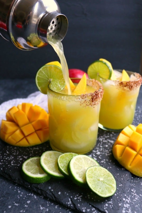 If you love a great margarita, then my Mango Margarita recipe is a must! Made with fresh mangoes, lime juice, tequila and Cointreau, this skinny margarita recipe is simple to make and completely delicious!