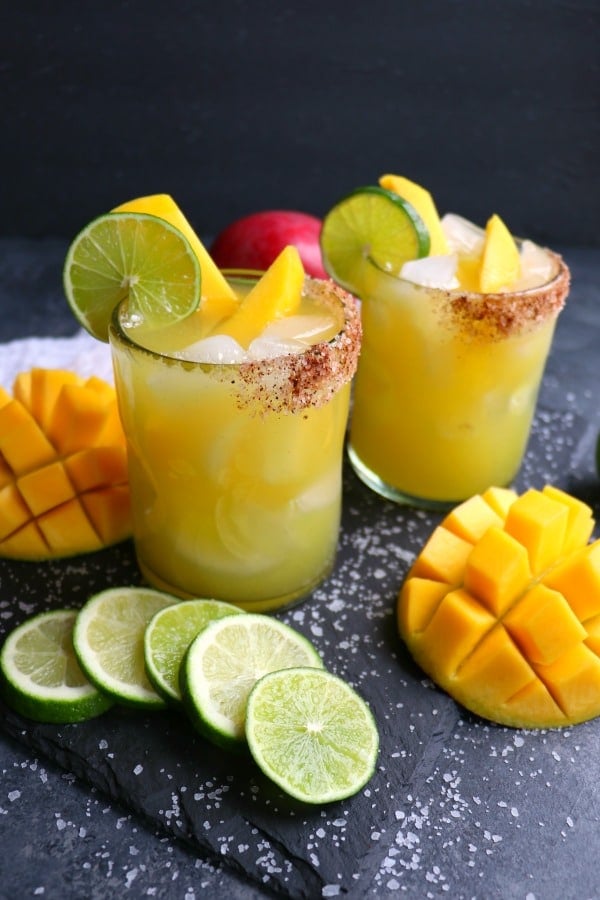 If you love a great margarita, then my Mango Margarita recipe is a must! Made with fresh mangoes, lime juice, tequila and Cointreau, this skinny margarita recipe is simple to make and completely delicious!