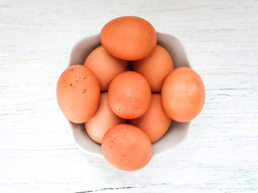 Hard boiled eggs in a small bowl.