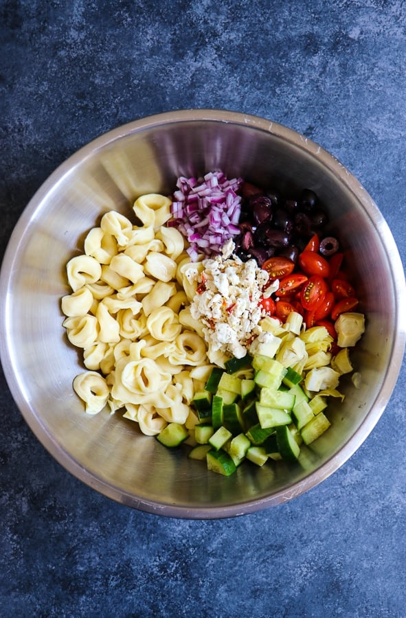 Do you love a really amazing, tortellini pasta salad? My Easy Greek Tortellini Salad recipe is the perfect dish for your next cookout. Loaded with all of your favorite Greek ingredients, this cold tortellini salad will be your new side dish for just about any meal!