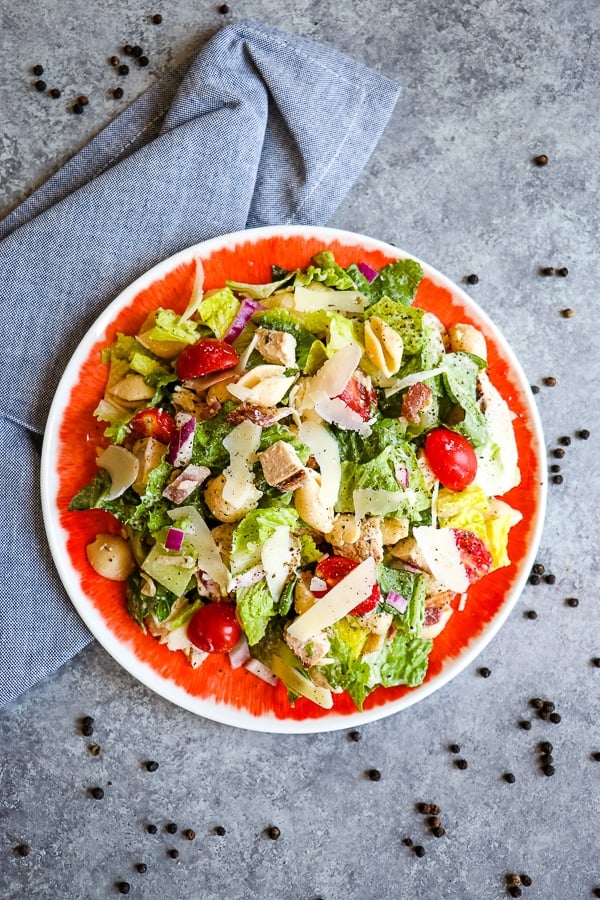 This delicious Chicken Caesar Pasta Salad will be your new favorite Healthy Pasta Salad recipe! Loaded with all of your favorite ingredients, this pasta salad with chicken, bacon, tomatoes, and a healthy Caesar dressing is perfect for your next pot-luck and great for meal-prepping!