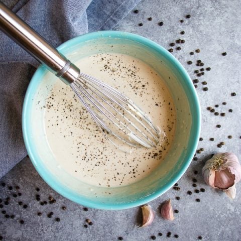 Forget the bottled stuff - this Healthy Caesar Dressing is way better than anything you buy off the shelf. This Greek yogurt dressing recipe is simple to make, tastes incredible and comes together in just minutes! Definitely the BEST Homemade Caesar Dressing around!