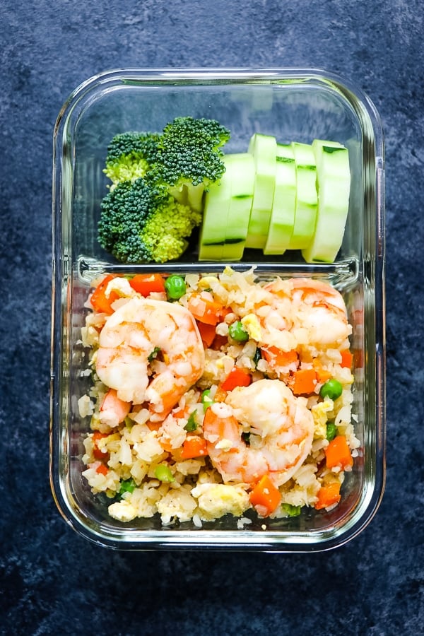 Once you try my Cauliflower Fried Rice Recipe you'll never buy take-out fried rice again! This Cauliflower Shrimp Fried Rice has all the great flavors and textures of your favorite take-out place, but without all of the carbs & calories. The perfect healthy shrimp fried rice!