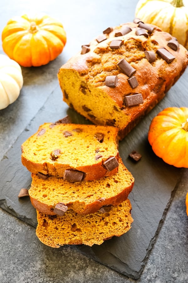 loaf of healthy pumpkin bread, sliced with chocolate chunks.