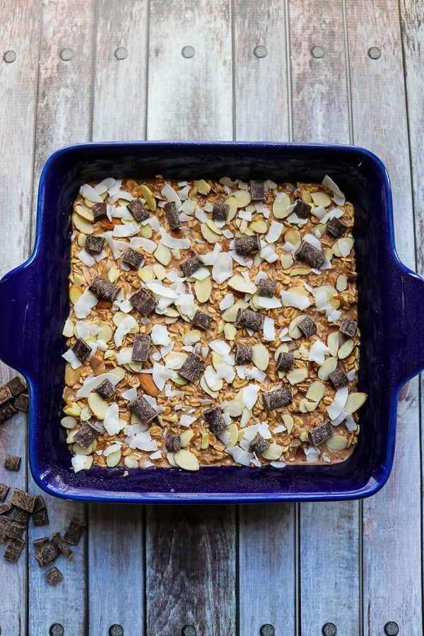 These healthy oatmeal bars will be your new favorite way to do breakfast! Made with coconut, almonds and a hint of chocolate, these baked oatmeal bars have all the flavors of the classic almond joy! With no refined sugar, flour or oil, these oatmeal breakfast bars are a great make-ahead  breakfast!