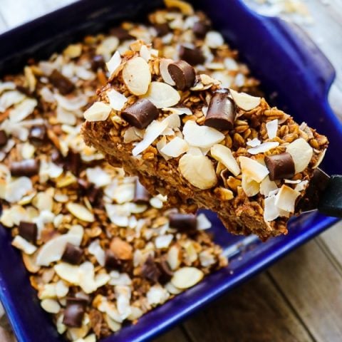 These healthy oatmeal bars will be your new favorite way to do breakfast! Made with coconut, almonds and a hint of chocolate, these baked oatmeal bars have all the flavors of the classic almond joy! With no refined sugar, flour or oil, these oatmeal breakfast bars are a great make-ahead  breakfast!