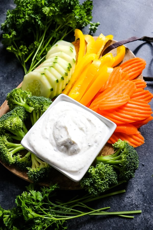 Need a healthy snack option? This simple, 5-ingredient Greek Yogurt Veggie Dip is the perfect way to enjoy fresh veggies. Enjoy with veggies, spread on a sandwich or topping a salad, this Greek Yogurt Ranch Dip is a great alternative to a dip mix!