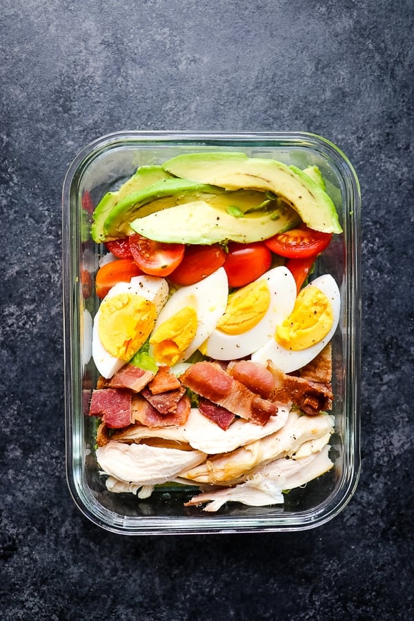 Healthy chicken cobb salad in a meal prep container.