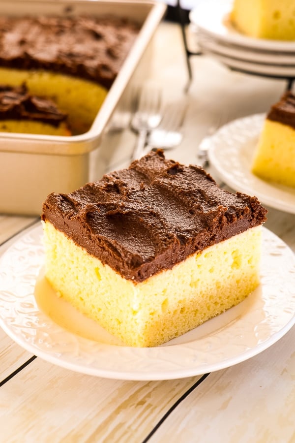 Is Yellow Cake with Chocolate Frosting your all-time favorite? Then this fluffy, delicious Buttermilk Cake recipe is right up your alley. This homemade buttermilk sheet cake is made in a 9x13 inch pan making is really simple to make, frost and enjoy. 