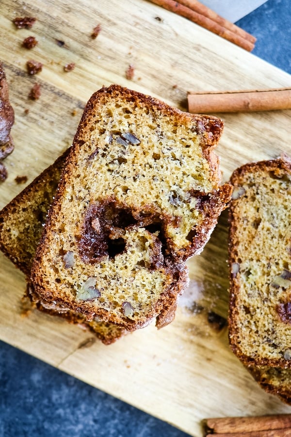Tired of your same-old banana bread recipe? This Cinnamon Swirl Banana Bread might just become a new family favorite. Super moist, flavorful and topped with a swirl of cinnamon sugar, this Cinnamon Banana Bread recipe is one you'll make over and over again!