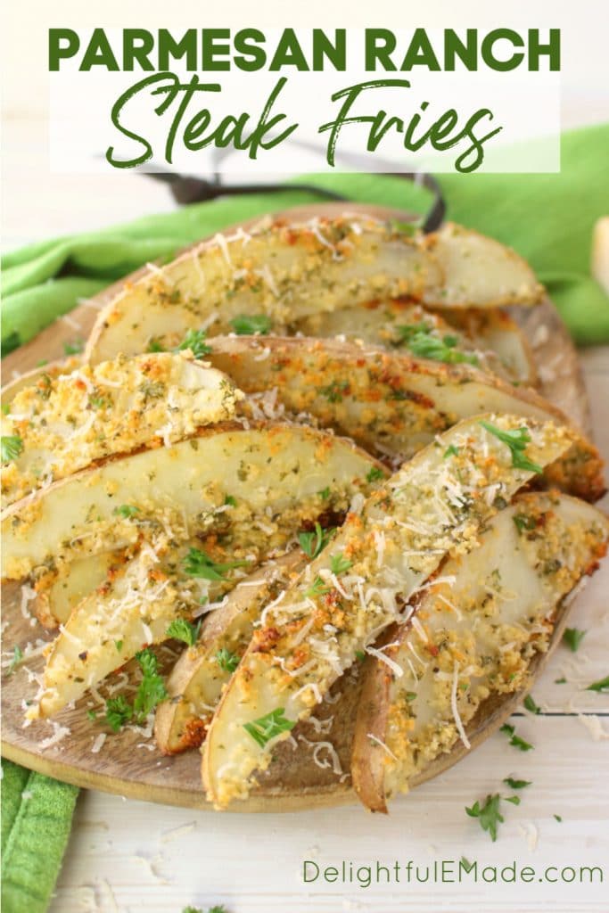 Wondering how to make steak fries? These crispy, baked steak fries will be a new family favorite! Healthier than greasy, fried potatoes, these thick cut potato wedges are coated in Parmesan cheese and ranch seasoning and baked to perfection! 